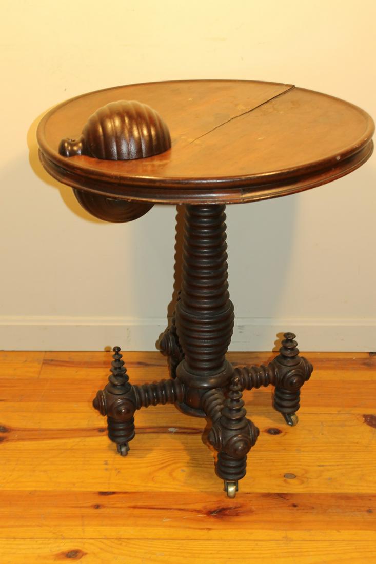 Game Table: Spool turned columned base game table with 2 game chip pockets undertop that swing out, size is 27 1/2" tall by 23 3/4" diameter