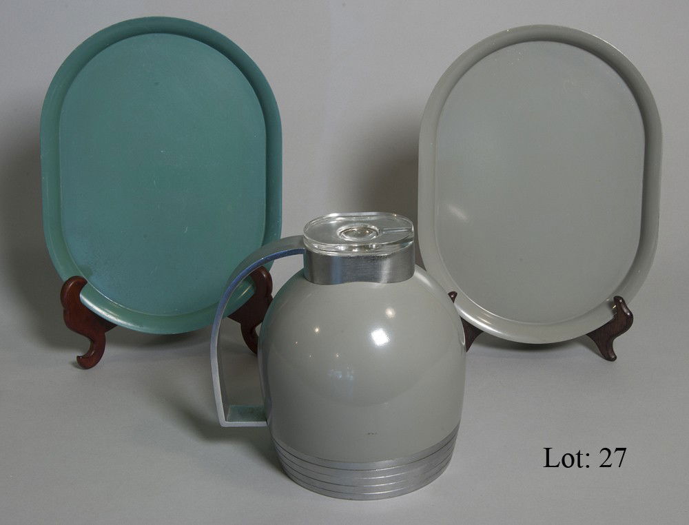 American Thermos Co. thermos: Mid century thermos with two matching trays. Model # 549, The American Thermos Bottle Co. "The Only Thermos, Vacuum Bottle, designed by Henry Dreyfuss." Norwich, Conn. 1935-1936. Has aluminum trim.