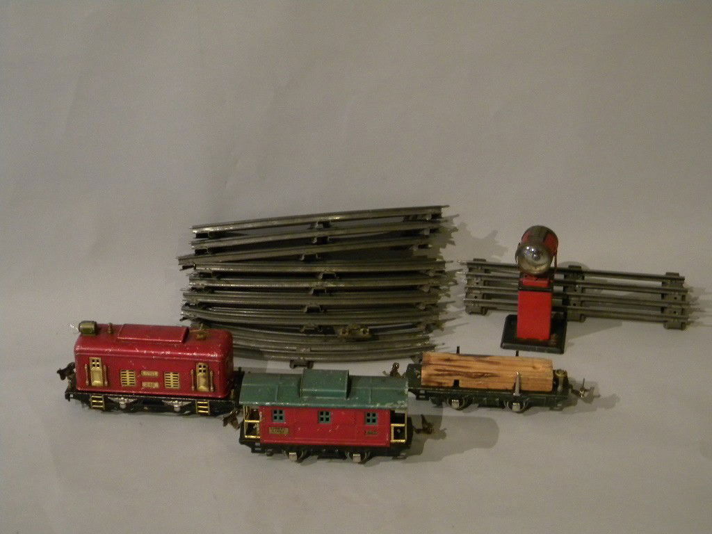lot of trains 1.#807 Lionel Lines 2. #248 O gage 3: lot of trains 1.#807 Lionel Lines 2. #248 O gage 3.Wood carrier along with light and several pcs of tracks