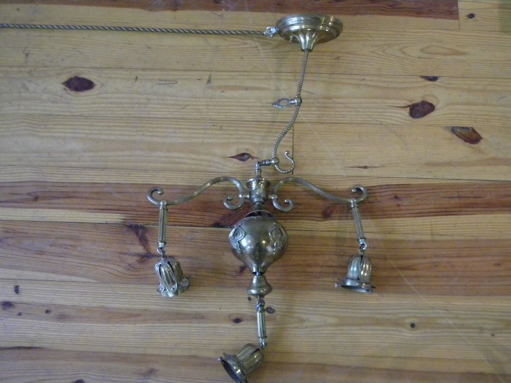 Hanging Light Fixture: 3 pendant light, 21 1/2" long by 15" deep, has brass bracket that mounts to wall, and an extruding light