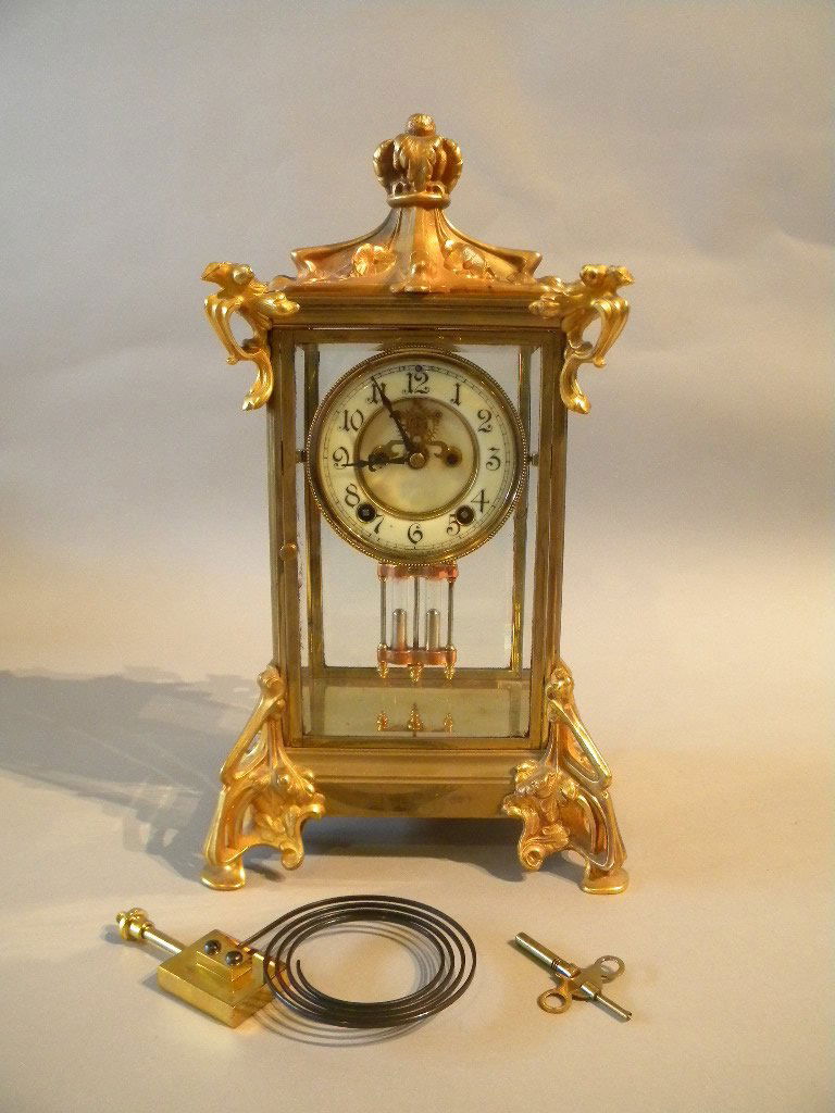 New Haven Mantle Clock: Art Nouveau clock with gold dore' floral relief, 16" tall