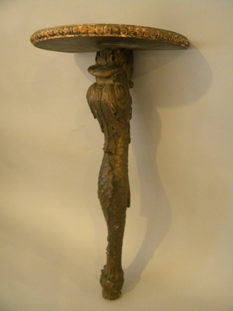 Dolphin Wall Mount Shelf: Carved hardwood column Dolphin shaped, with shelf mounted on top. Attaches to wall with bracket. Size is 28" tall