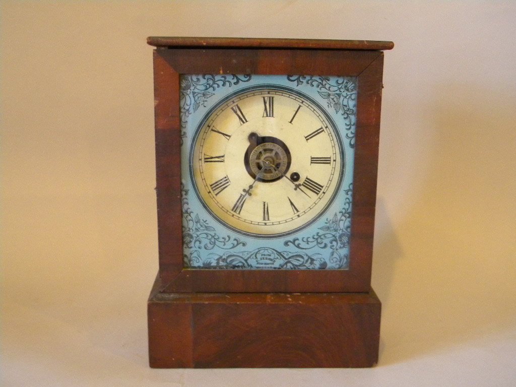Chauncey Jerome Timepiece: Wooden dial, Chauncey Jerome clock, reverse painted glass, identified in the glass, has bell alarm size is 12 1/2" tall by 9" wide