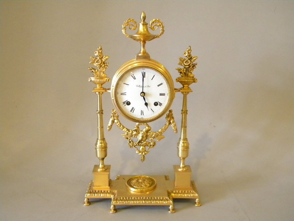 Brass "Collection D Art": Classical style shelf clock with porcelain dial and key wind. 15" tall by 9" wide