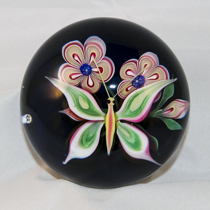 Baccarat, Modern 1972 Paperweight: Modern Baccarat 1972 paperweight. Cane 1, lampwork, insect, dragon fly. Dragon fly - pink, green, and white millifiori; 2 red, tan, and white primrose type flowers, 2 buds, transluscent dark blue grou
