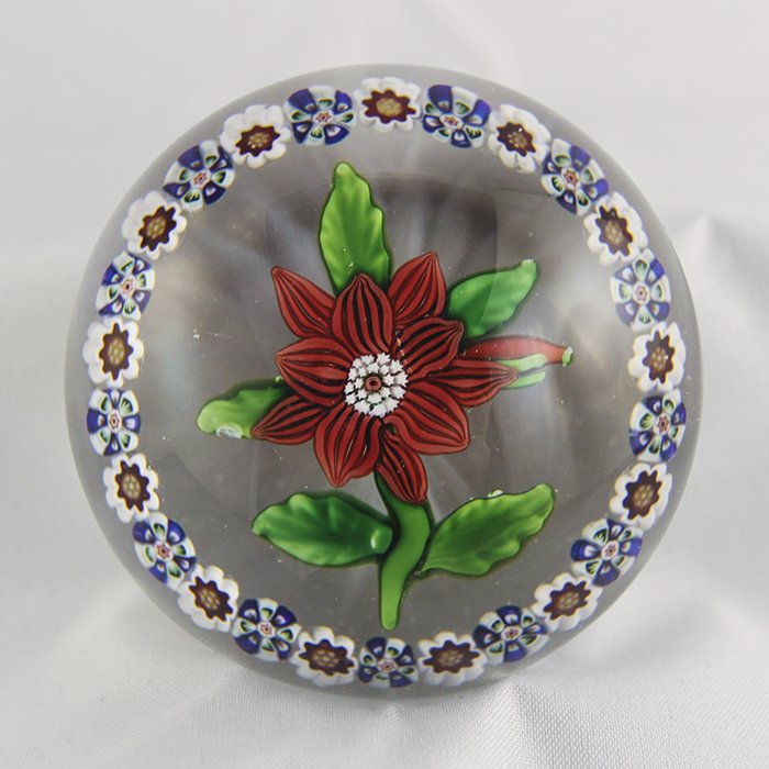 Baccarat, Antique Paperweight: Antique Baccarat paperweight. Cane 2, lampwork, flower, clematis. Salmon colored double clematis, bud, green leaves and stem, surrounded by ring of complex millifiori canes (red & white canes alternat