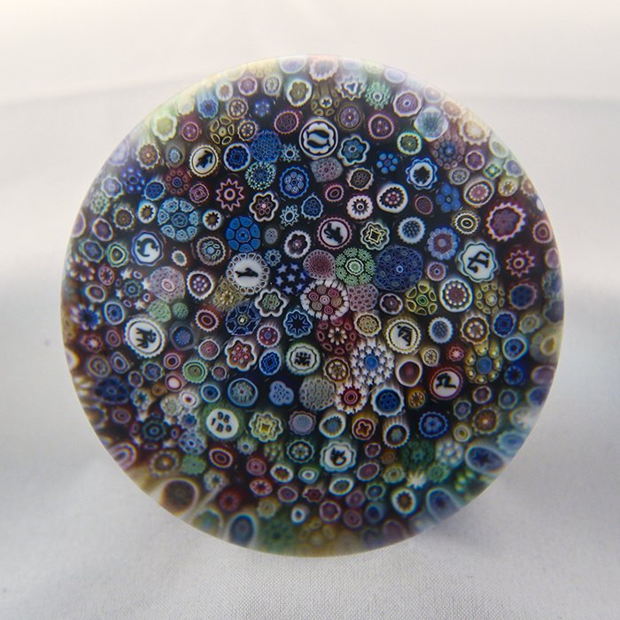 Baccarat, Modern 1989 Paperweight: Modern Baccarat 1989 paperweight. Cane 1, millifiori, church. Close pack millifiori "Church Weight" with Zodiac silhouette canes. DW: 80.3, HW: 62.4, W: 691.5.