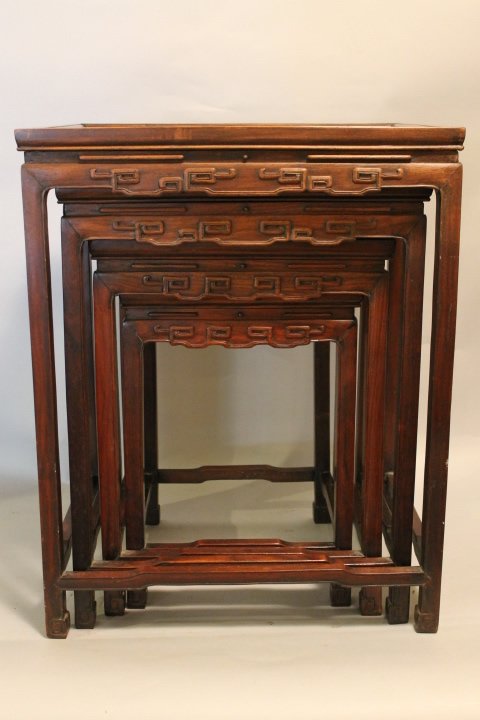 25. Set of Rosewood Nesting Tables: Set of 4 nesting tables in Rosewood, tallest height is 25 1/4 down to 17 1/2". Oriental design