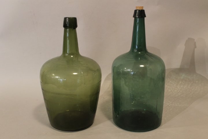 231. 2 Antique Demijohns: 1. 17 1/2" tall light olive green mold blown with pontil mark. 2. 18 1/4" mold blown, blue green