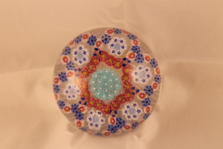 Baccarat, Modern 1971 Paperweight: Modern Baccarat 1971 paperweight. Cane 1, millifiori, patterned. Patterned millifiori with 6 semi circular panels on light lace ground, light blue center surrounded by irregular circle of red canes, c