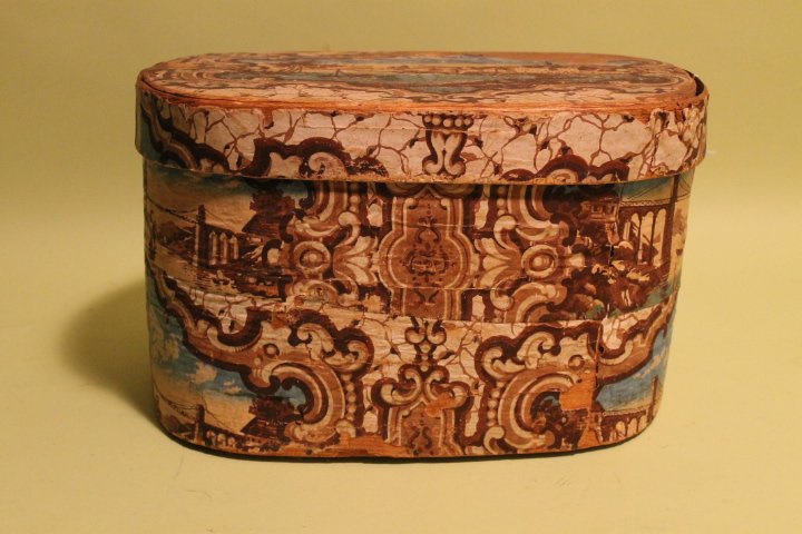 Hanna Davis Band Box: Large bandbox w/Hannah Davis label, Jafrey NH 1849, harbor scene, in as found original condition. This is made of wood and the dimensions are 16" long by10" tall by 11 1/2" deep