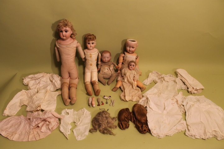 5 Porcelain Dolls: 1. Bye-Lo by Grace putman, 10 1/2" some soiling, 2. Kestner 152 12" tall porcelain flakes to eye lids, 3. Armand Marseille 13, 27" long, missing forearms, 4. Kestner 20" long, porcelain head, missing