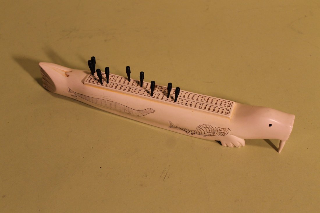 Composition Walrus Cribbage Board: Signed PMS with anchor on base, figural cribbage board, size is 11" long, by about 1 1/2" tall and 1 1/2" wide