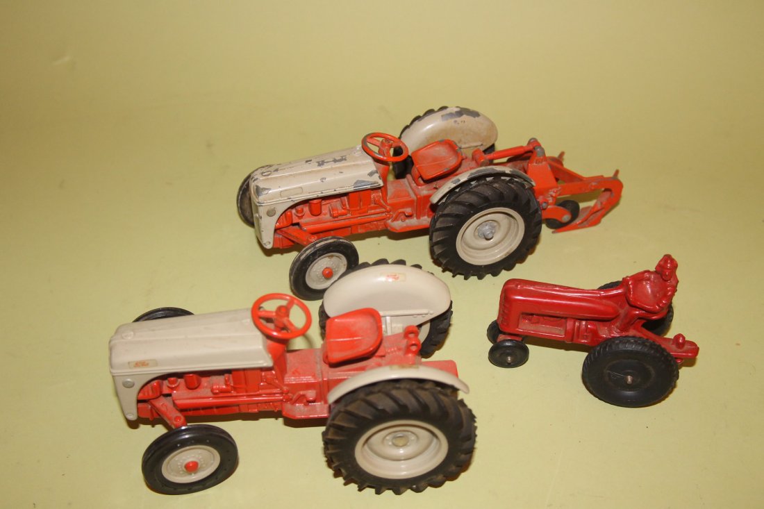 Lot of 3 Tractors, Trucks, and Cars: 1. Ford with plow, cast metal 9", [some paint loss] 2. Ford cast metal, 7" 3. International plastic 4"