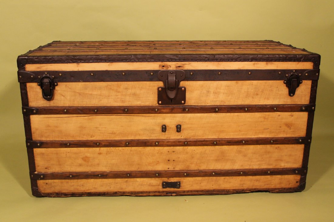 Louis Vuitton 1880-1900 Steamer Trunk: Louis Vuitton steamer trunk, handles with LV stamped, and fitted interior with paper label, 454 Strand, 1 Rue Scribe, trunk # 44779. Size is 43 1/2" x 22 1/4" and 22 1/2" tall