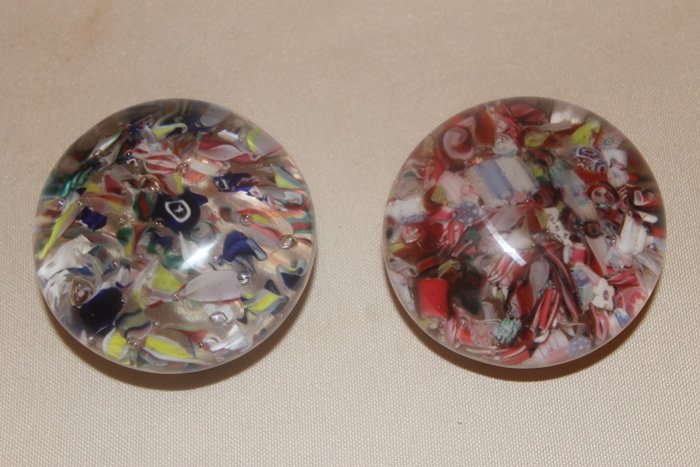 2 New England Paperweights: 1. Cane and filigree surrounding a running rabbit cane size is 2 5/8", interior swirl marks and rough base 2. Scrambled pieces of cane and filigree, 2 5/8" diameter, surface blemish
