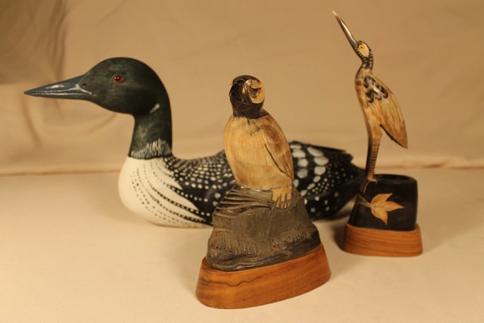 3 Carved Sculptures: 1. George Abatiello 1990 Common Loon, signed and numbered FD0080990 17" 2. Buffalo horn carved Heron signed B. Stein 9 1/4" tall 3. Buffalo horn carved Puffin, signed B. Stein on horn and base and dat