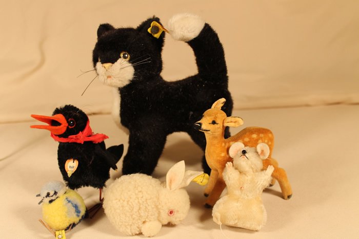 6 Steiff Animal Figures: Fawn, [missing button], chick button & cloth tag, cat button and cloth tag, rabbitt button and cloth tag, crow, paper tag cloth tag, and button, mouse cloth tag and button