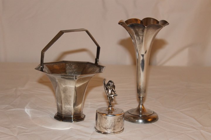 3 Pcs of Tiffany Sterling: 1. Stamp holder with Eros figure 2. Tiffany fluted trumpet vase [weighted] 7 3/4" tall 3. Tiffany basket 6 1/4" tall to top of handle total weight 17.77 ozt including weighted piece