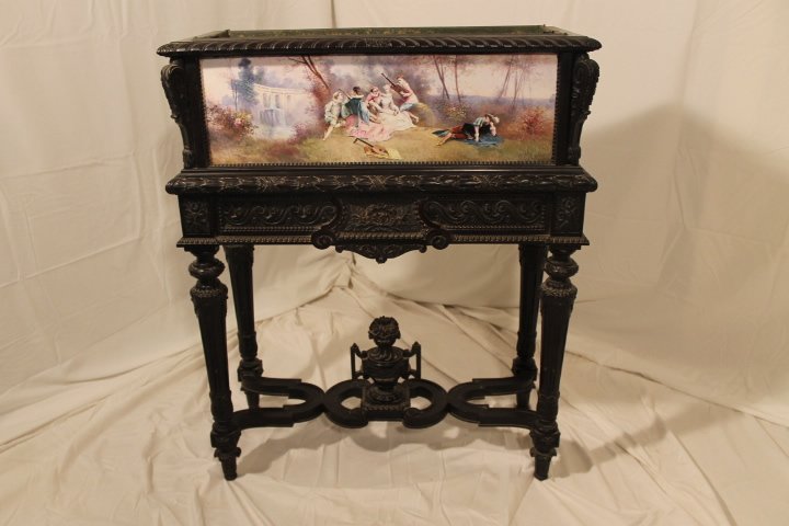 Planter Fitted w/3 Porcelain Plaques: Wood floor planter fitted with 3 porcelain plaques, French scenes signed Bellgayes on front and 2 sides, tin fitted insert, height is 35" length is 28", and width is 12 1/2"