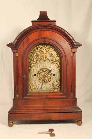 German Wooden Case Clock: German wooden case clock with chimes, brass works, K-Elite Germany #122178, size is 22" tall x 13 1/2" x 8 1/2"