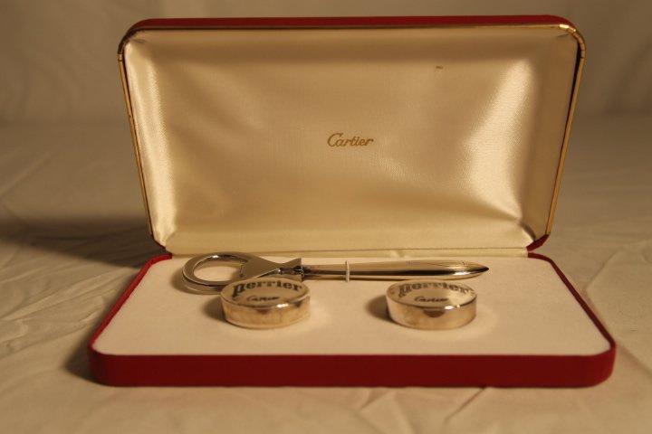 Cartier Sterling for Perrier: Cartier sterling handle bottle opener and two sterling bottle caps for Perrier in box