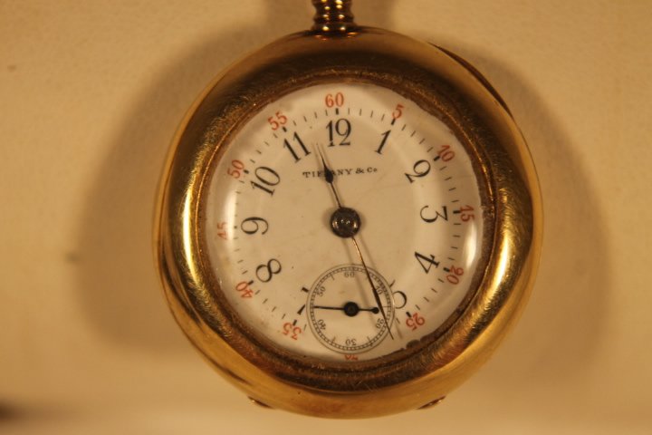 Tiffany Ladies Open Face Watch: Pocket watch, ladies, Tiffany, monogrammed, 18kt gold open face watch, with second hand, weight is 36 grams, diameter is 1 3/16"
