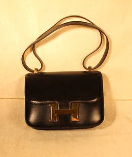 Hermes Constance Bag: Hermes Constance bag, with felt storage bag in a Hermes box. Size is 9" x 7". Has the date stamp. Color is black.