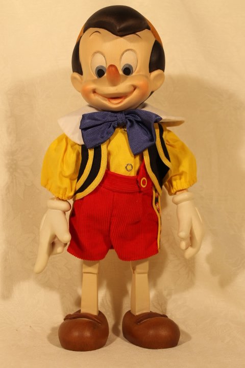 ANRI Wood Carved Pinocchio Sculpture: Pinocchio wood sculpture by ANRI LE 124/2500, certificate of authenticity, 13" tall, signature of Ulrich Bernardi unused in original condition