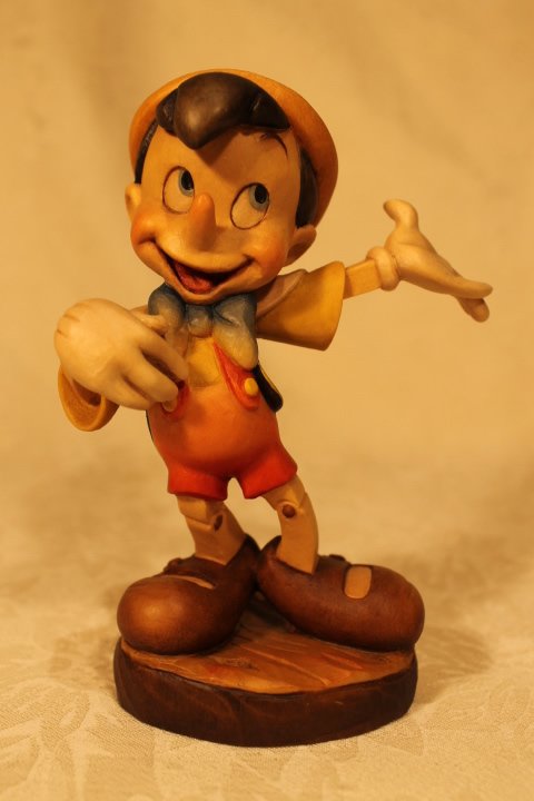 Walt Disney Co ANRI "Pinocchio" Sculpture: Walt Disney Co ANRI "Pinocchio" Sculpture. LE 90/500 ANRI wood sculpture, signed by Ulrich Bernardi, 5.75" tall, COA