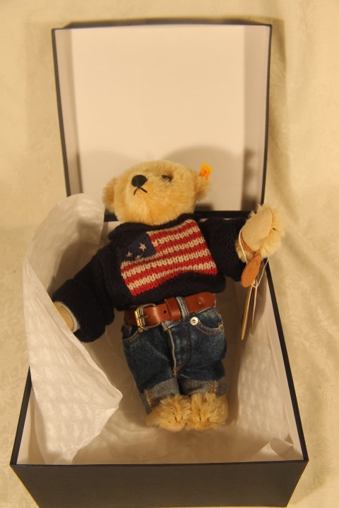 Ralph Lauren "Polo" University Flag Steiff Bear: Ralph Lauren Polo Fifth Avenue Steiff Bear. Designed to celebrate the opening of Polo Ralph Lauren flagship store on Fifth Avenue, NY. Bear decked out in heritage inspired outfit. "Polo" # 1597 leathe