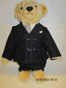 Steiff Polo Ralph Lauren Teddy Bear, Chairman I: Steiff Polo Ralph Lauren Teddy Bear, Chairman I. Steiff bear dressed in navy blue striped wool suit, sunglasses. Ear tag 650598. LE ?/1000. 1992. 17'T