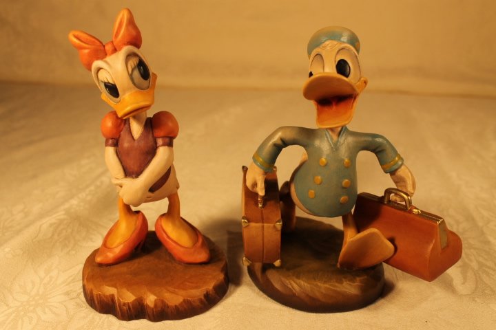 2 Anri Wood Sculptures signed Ulrich Bernardi: Lot of 2 wood sculptures, Donald and Daisy by Anri signed Ulrich Bernardi, 6" tall #s 124/500 and 320/500