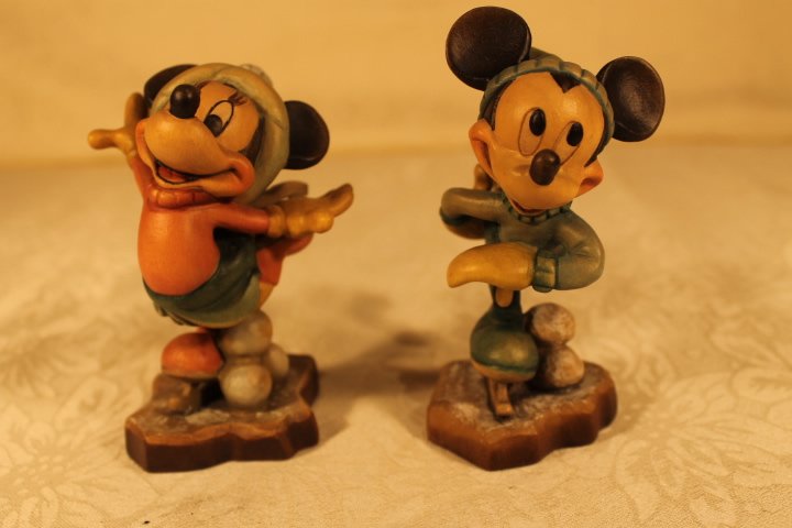 2 Anri Wood Sculptures: Lot of 2 Anri wood sculptures of Mickey and Minnie on skates, both #141, both signed Ulrich Bernardi, size is 4" tall