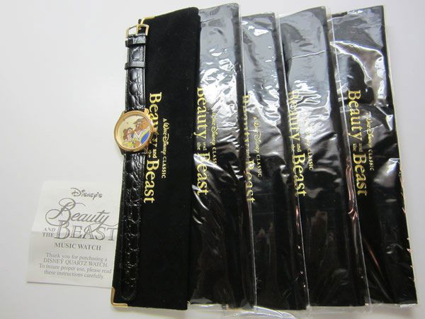 Lot of 5 Musical Beauty & The Beast Watches: Lot of 5 Disney Musical Melody Beauty & The Beast Watches. Face depicts classic Beauty and the beast, black leather band, gold tone bezel, ss caseback, shock resistant. Plays the theme song to the mov