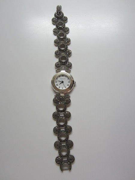 Judith Jack Sterling Marcasite Watch Bracelet: Judith Jack Sterling Marcasite Watch Bracelet with Mickey Mouse silhouettes throughout band. Marcasites all in place, marked Disney/Sterling/JJ. 7"l x 1"w. 1.450 ozt including stones