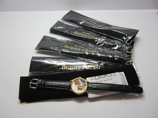 Lot of 5 Disney Musical Beauty & The Beast Watches: Lot of 5 Disney Musical Melody Beauty & The Beast Watches. Face depicts Disney classic Beauty & the Beast, black leather band, gold tone bezel, stainless steel caseback, shock resistant, plays the the