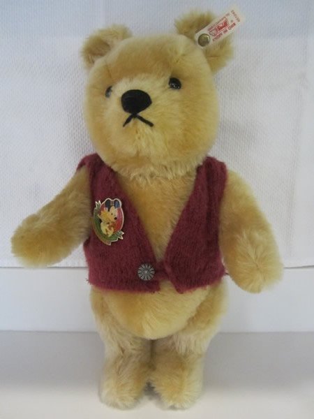 Steiff Winnie The Pooh Teddy Bear: Rare Walt Disney World Doll & Teddy Bear Convention Steiff Winnie the Pooh. EAN 651243, LE 00616/2500. Honey blonde mohair, jointed, wine colored vest w/ decorative silver button, growler. Signed by J