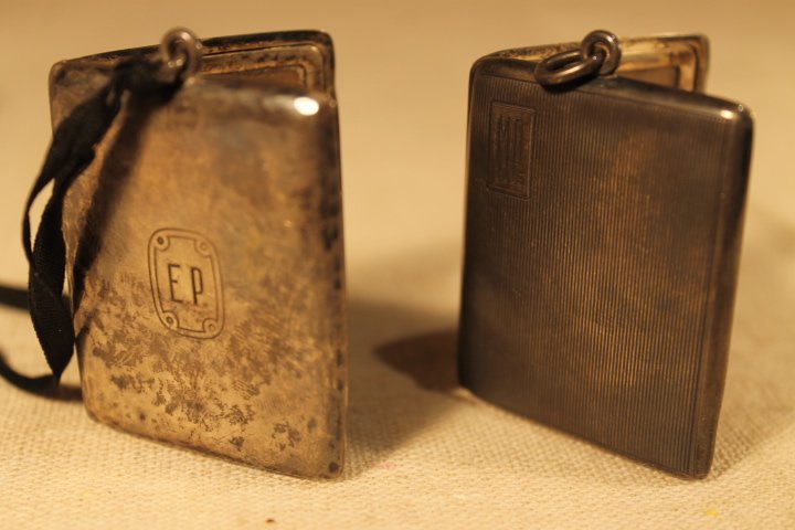 2 Sterling Silver Photo Lockets: 2 Bailey Banks & Bidle sterling photo lockets with ribbon lace 1 7/8" tall by 1 1/2" wide. Weight is 1.69 ozt