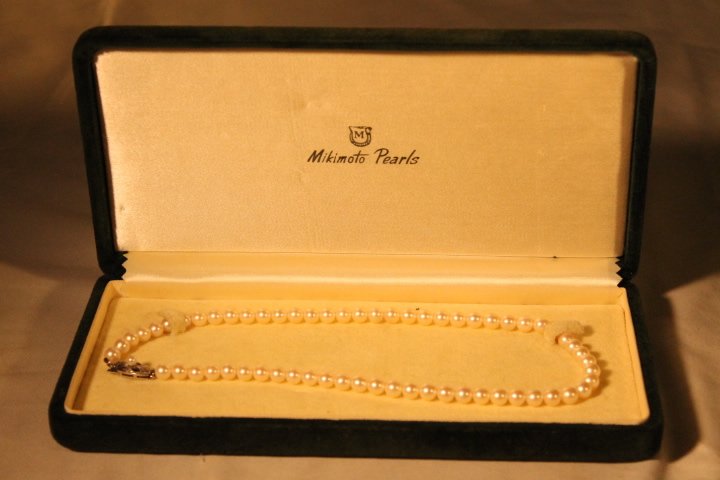 Mikimoto Pearls in Box: Sterling clasp Mikimoto pearls, length is 15 1/2" long with sterling clasp, size of pearl is about 1/4" or 6mm.