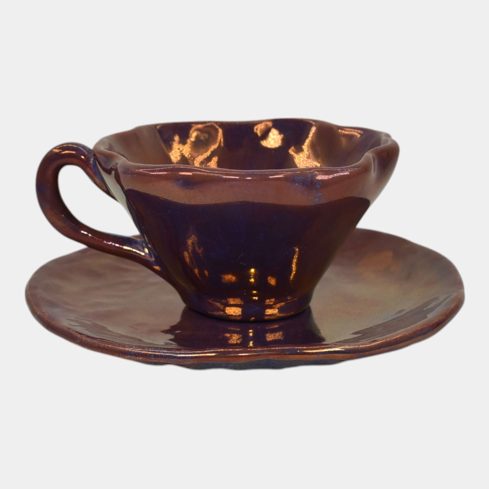 Ira And Ella Peters For Pewabic Art Pottery Purple Iridescent Tea Cup And Saucer: We offer in house shipping on all items. Plus spend $2000 on winning bids and your shipping is free. Ira And Ella Peters For Pewabic Art Pottery Purple Iridescent Tea Cup And Saucer Elegant handcrafte