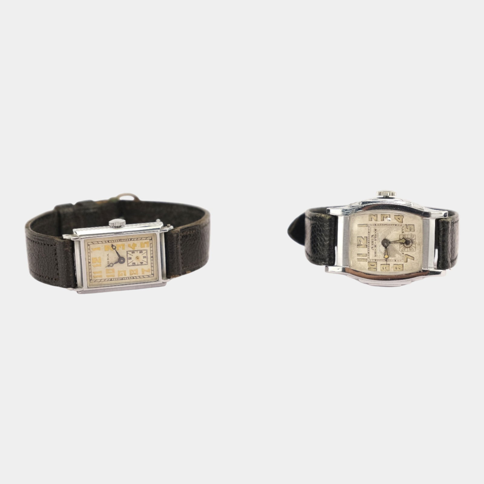 Abra Watch Co. 1930s Silver Leather Band Streamlined Art Deco Wristwatches: Stylish and refined, this pair of Abra Watch Co. wristwatches feature elegant rectangular cases with geometric Art Deco dials and leather bands, showcasing the sleek craftsmanship and sophistication o