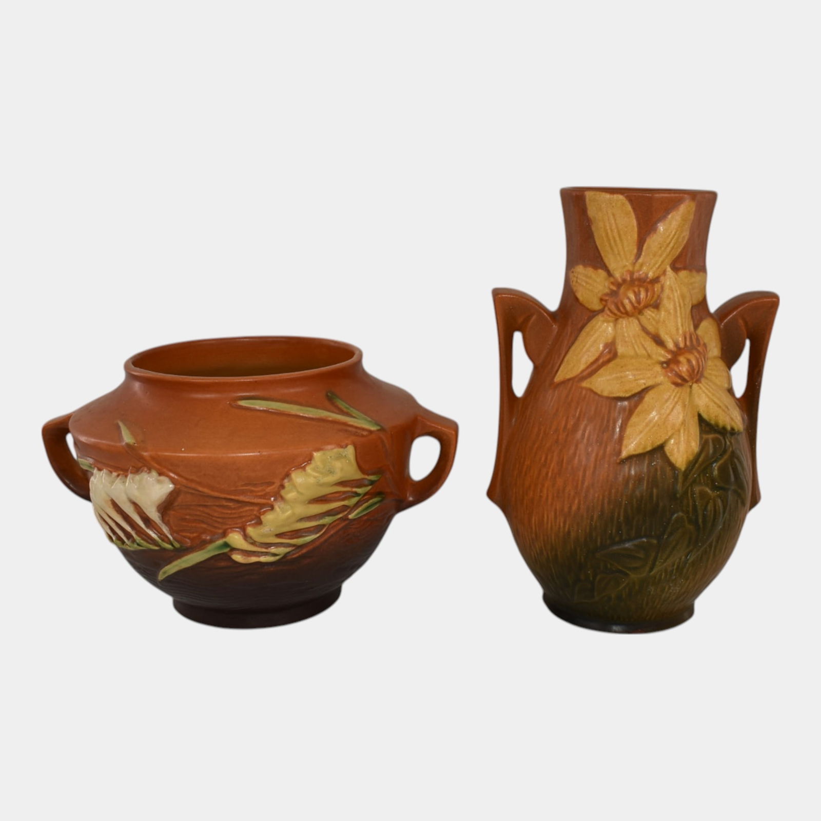 Roseville Clematis Freesia Brown Vintage Pottery Vases: We offer in house shipping on all items. Plus spend $500 on winning bids and your shipping is free. Roseville Clematis Freesia Brown Vintage Pottery Vases Nice mold and color. Excellent condition. Age