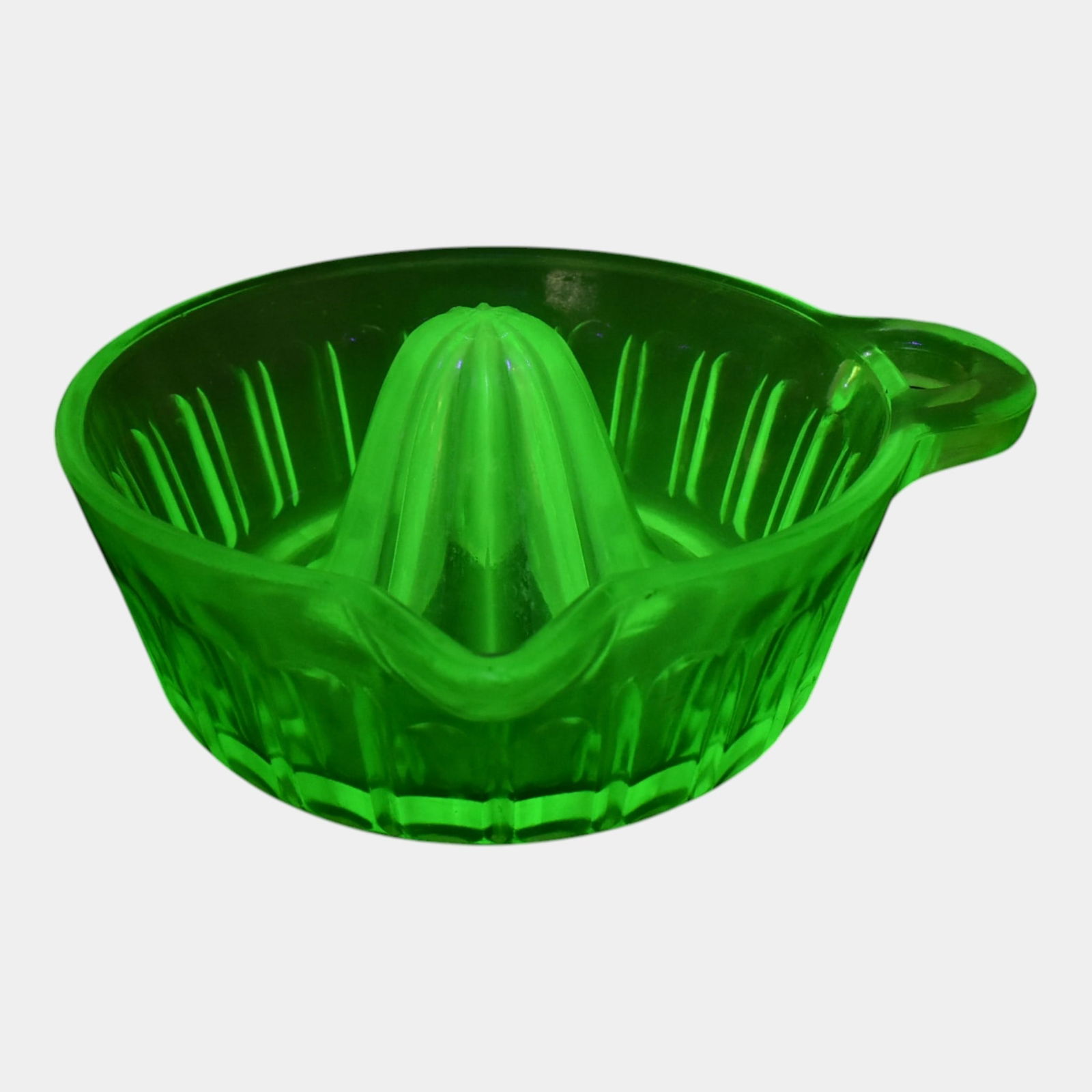 Uranium Green Depression Glass Tab Handled Citrus Juicer: We offer in house shipping on all items. Plus spend $500 on winning bids and your shipping is free. Uranium Green Depression Glass Tab Handled Citrus Juicer Excellent condition. Piece glows green unde
