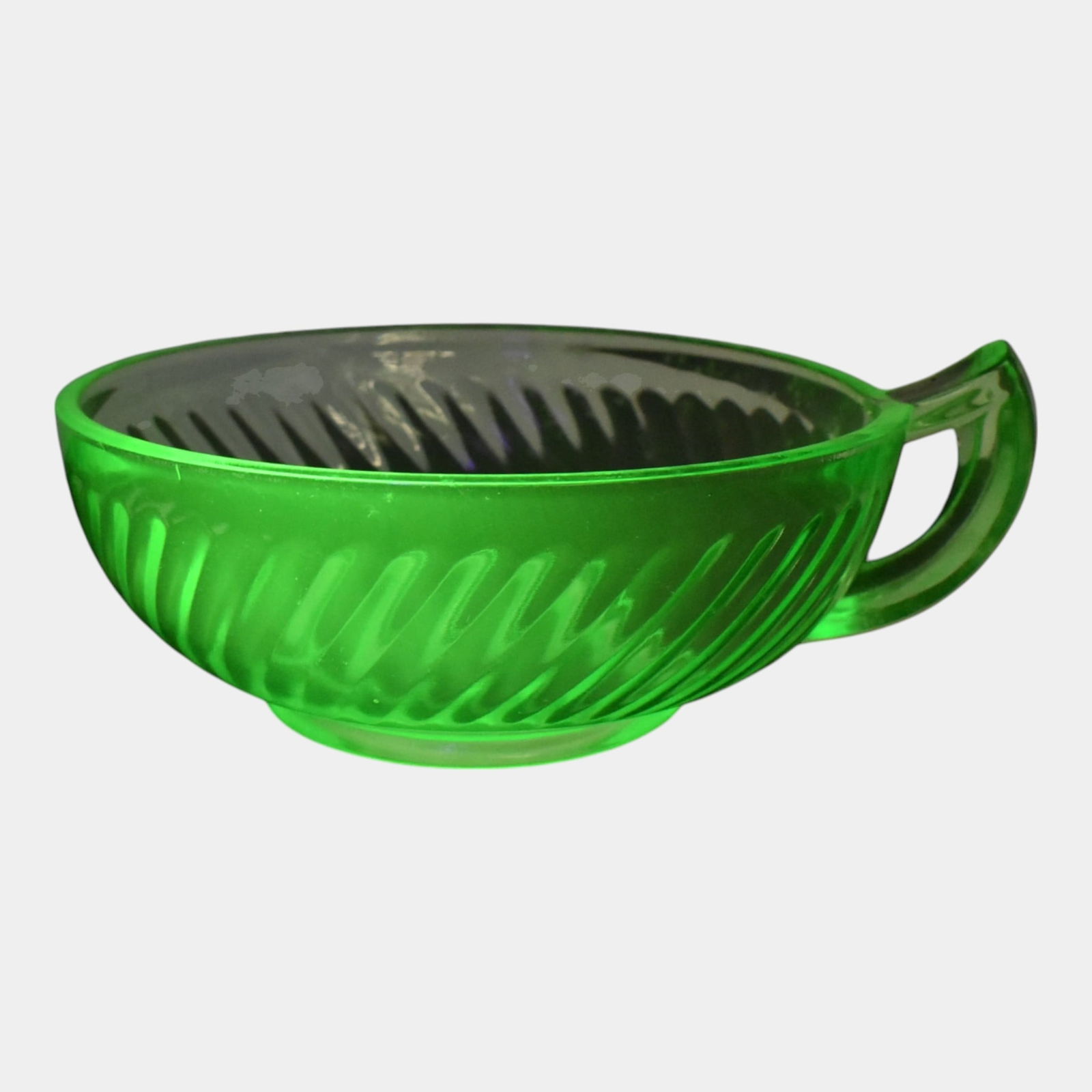 Uranium Green Depression Glass Handled Bowl: We offer in house shipping on all items. Plus spend $500 on winning bids and your shipping is free. Uranium Green Depression Glass Handled Bowl Excellent original condition. No damage or repair of any