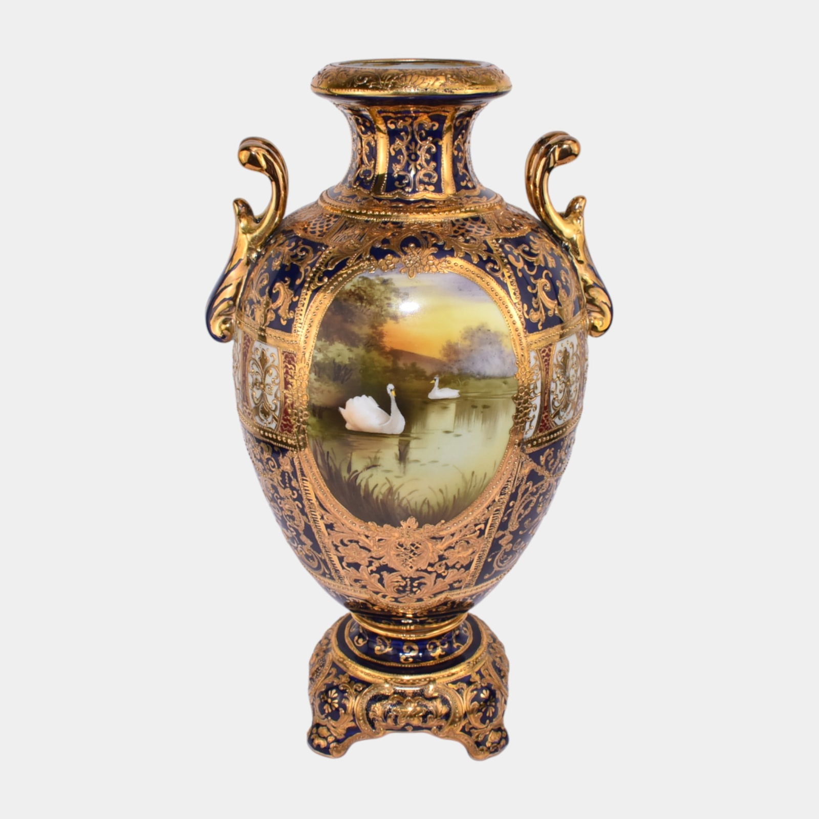 Noritake Japanese Hand Painted Cobalt Blue Gold Gilt Swan Handled Urn Vase: Noritake Japanese Hand Painted Cobalt Blue Gold Gilt Swan Handled Urn Vase Lavishly ornate and richly pictorial, this early 20th-century Nippon vase features a classical handled form with heavy raised