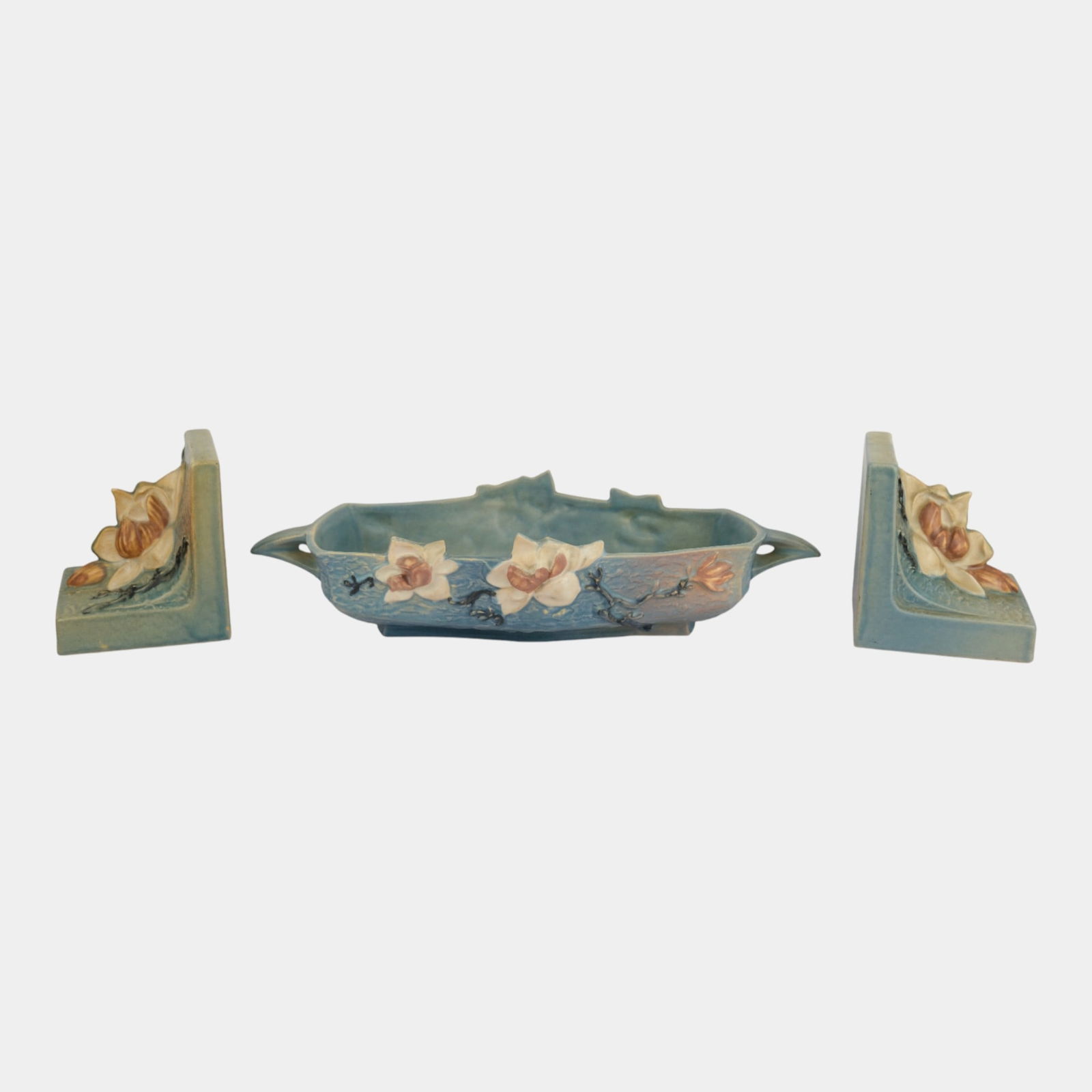 Roseville Magnolia Blue Vintage Art Pottery Ceramic Console Bowl Bookends: Roseville Magnolia Blue Vintage Art Pottery Ceramic Console Bowl Bookends Excellent condition. Age related wear.Bottom marked as shown.Bowl is 3 1/2" tall and 17" wide. Bookends are 5" tall and 4