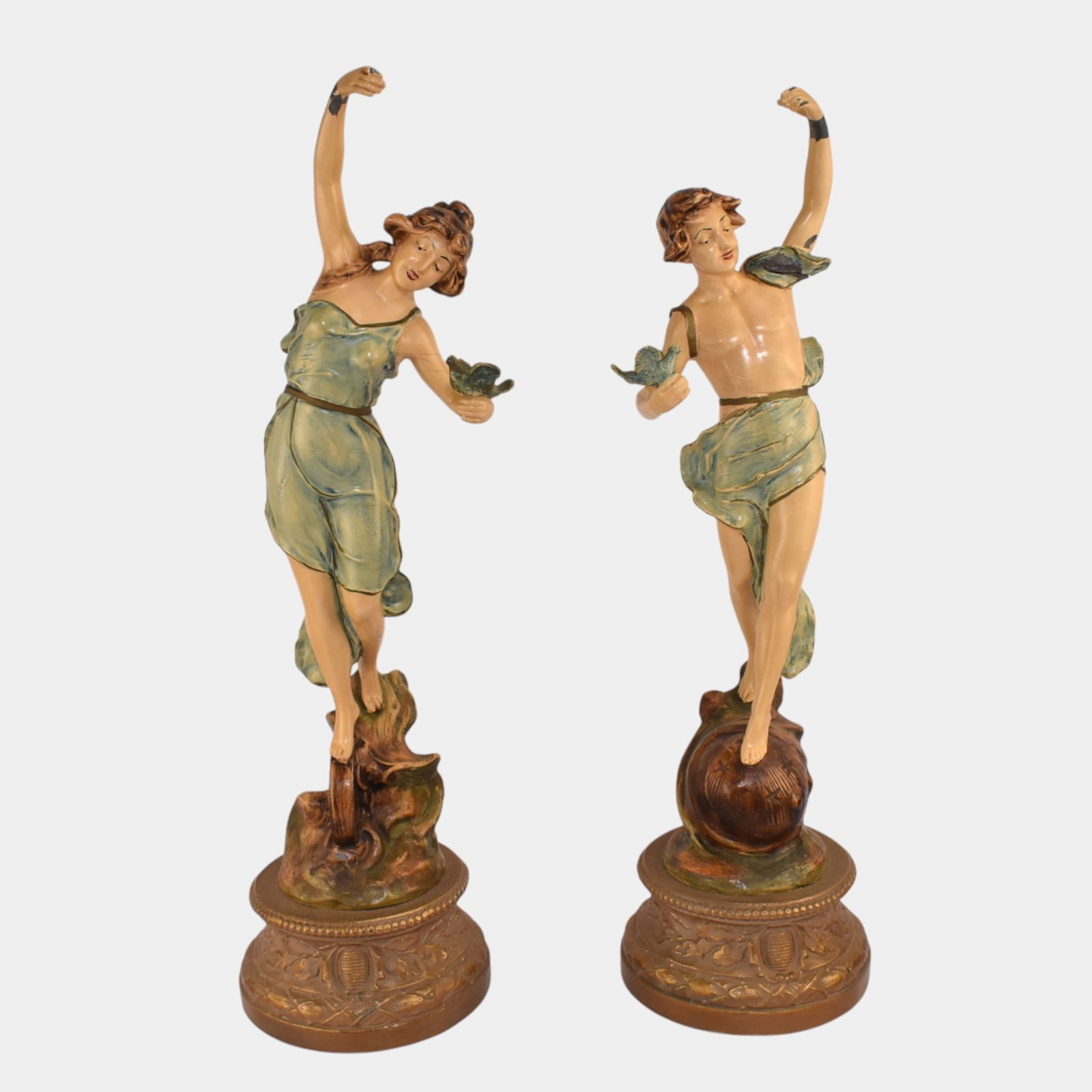 French Art Nouveau Man And Woman Enameled Spelter 20" Tall Figural Sculptures: French Art Nouveau Man And Woman Enameled Spelter 20" Tall Figural Sculptures Elegant French Art Nouveau figural pair depicting graceful maidens with birds. Beautifully modeled with flowing drapery, s