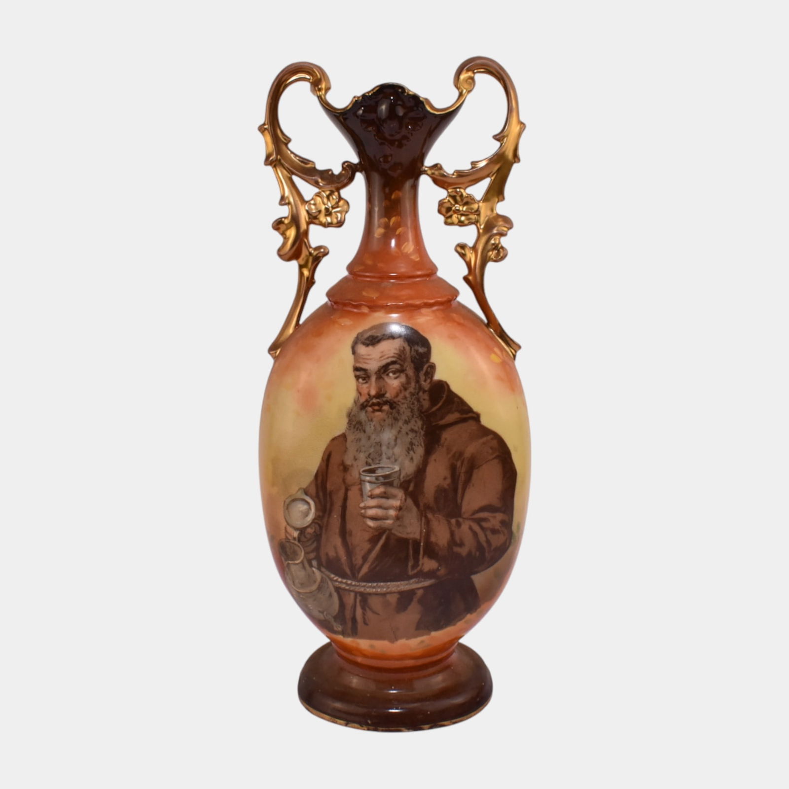 Victoria Carlsbad Austria Drinking Monk Portrait Gold Gilt Handled Vase: Victoria Carlsbad Austria Drinking Monk Portrait Gold Gilt Handled Vase Excellent condition. Age related wear. Vase is 13 3/4" tall and 5" wide.