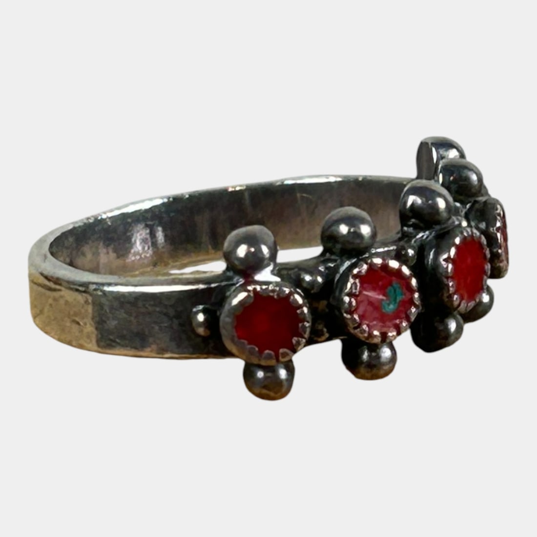 Sterling Silver 925 Southwestern Red Enameled Decorated Ring Size 6: Boldly graphic and richly textured, this mid-century sterling silver band ring features a repeating row of red enamel panels with applied decorative motifs, punctuated by raised silver bead accents